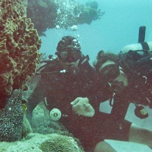 My wife and I with the Jeweled Moray Eel - Can I keep him :)